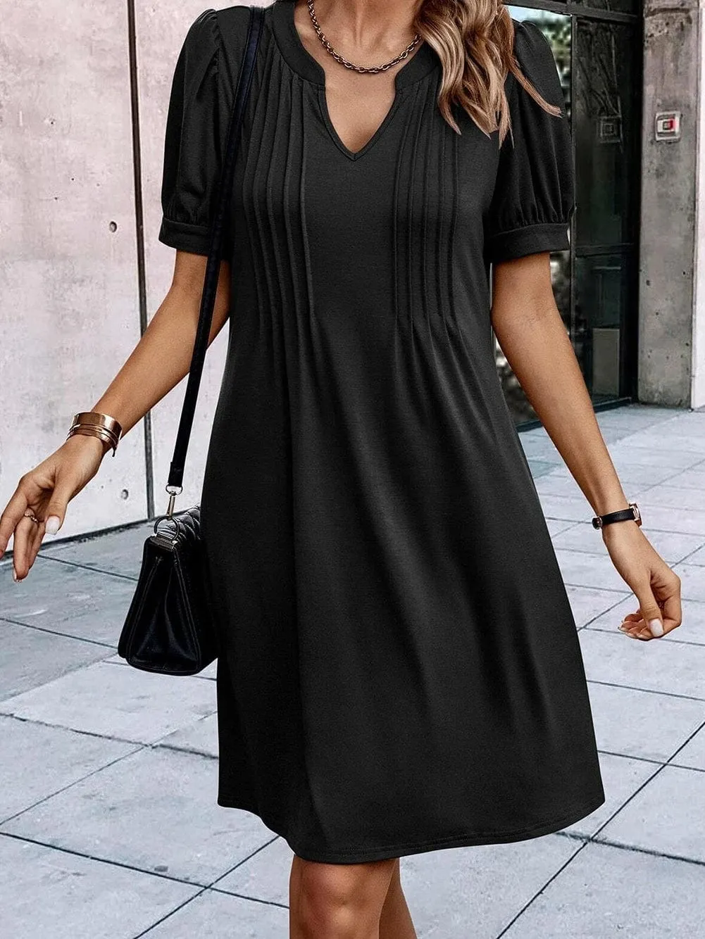 Black Pleated Shift Dress with Notched Neck and Puff Sleeves